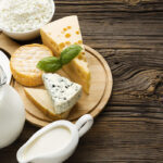 top-view-delicious-cheese-with-milk-table_23-2148610600